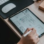 person writing on white paper